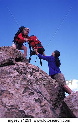 Man Handing Woman a Backpack View Large Photo Image Stock Image - Man Handing Woman a Backpack. Fotosearch