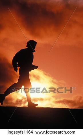 Man Jogging at Sunset View Large Photo Image Picture - Man Jogging at Sunset. Fotosearch