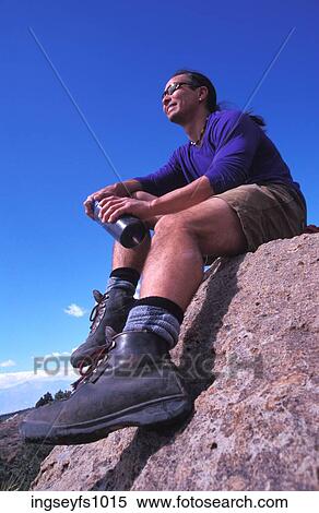 Stock Photography - Man Resting During a Hike. Fotosearch