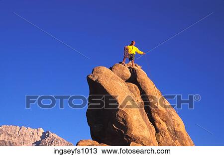 Stock Image - Man Rock Climbing. Fotosearch