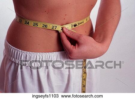 Measuring a Waist View Large Photo Image Stock Image - Measuring a Waist. Fotosearch