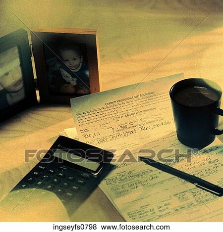 Stock Photo - Pictures of Children on Someone's Desk. Fotosearch