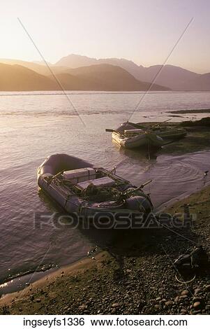 Stock Photograph - Rafts Pulled Up on Bank of Copper River. Fotosearch