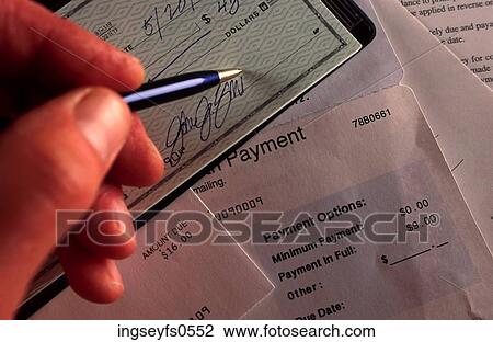 Stock Image - Signing A Check. Fotosearch