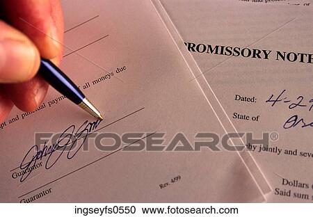 Stock Image - Signing A Document. Fotosearch