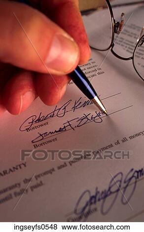 Signing A Document View Large Photo Image Stock Photo - Signing A Document. Fotosearch