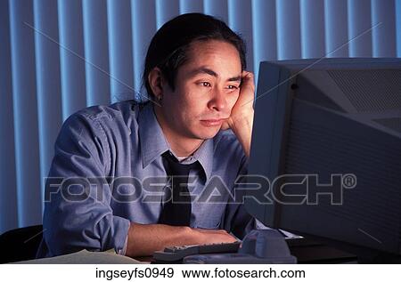 Sleepy Man Working Late at Office View Large Photo Image Stock Photo - Sleepy Man Working Late at Office. Fotosearch