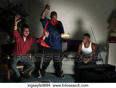 Sports Fans Watching a Game View Large Photo Image Picture - Sports Fans Watching a Game. Fotosearch