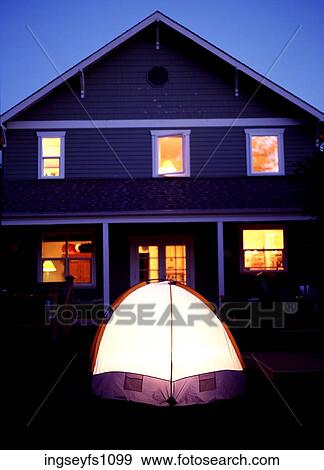 Stock Photo - Tent in Yard and House all Lit Up. Fotosearch