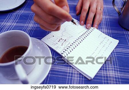 Stock Photo - Traveler Writing Directions. Fotosearch
