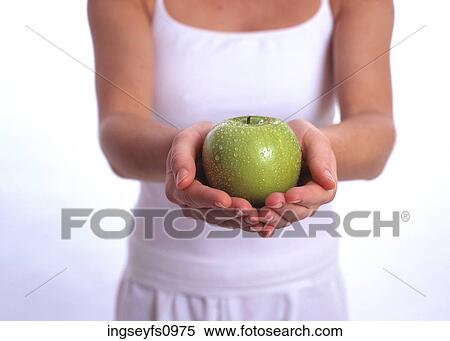 Woman Holding an Apple View Large Photo Image Stock Photography - Woman Holding an Apple. Fotosearch