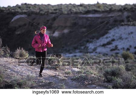 Woman Jogging on Ridge View Large Photo Image Stock Photo - Woman Jogging on Ridge. Fotosearch