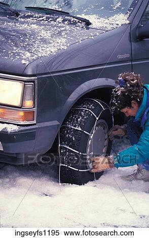 Woman Putting Chains on a Tire View Large Photo Image Stock Photography - Woman Putting Chains on a Tire. Fotosearch