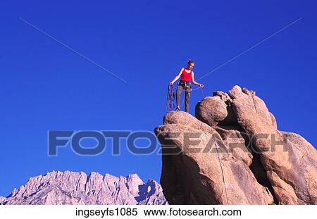 Stock Photography - Woman Rock Climbing. Fotosearch