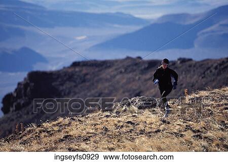 Woman Running on High Ridge View Large Photo Image Stock Photo - Woman Running on High Ridge. Fotosearch