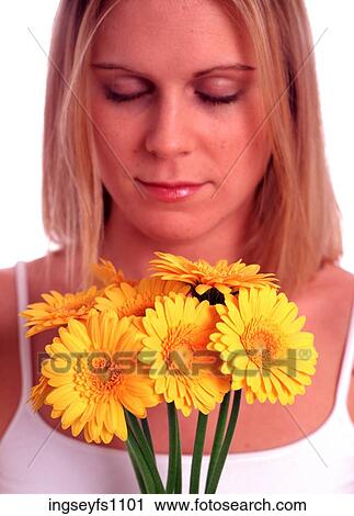 Woman Smelling Yellow Flowers View Large Photo Image Stock Image - Woman Smelling Yellow Flowers. Fotosearch