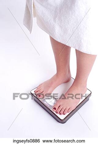 Woman Standing on Scale View Large Photo Image Stock Photograph - Woman Standing on Scale. Fotosearch