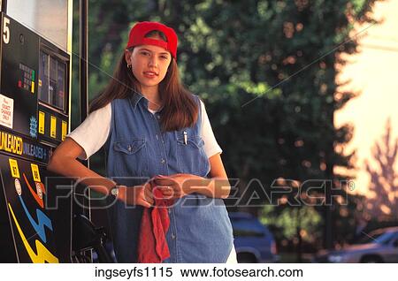 Stock Photography - Woman Working at Gas Station. Fotosearch