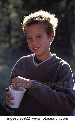 Stock Image - Young Boy Camping. Fotosearch