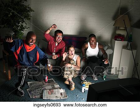 Young Friends Watching a Game View Large Photo Image Stock Image - Young Friends Watching a Game. Fotosearch
