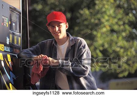 Stock Photo - Young Man Working at Gas Station. Fotosearch