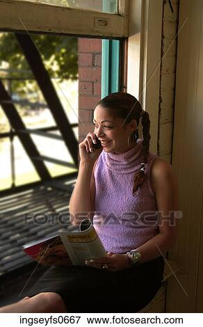 Young Woman on Cell Phone View Large Photo Image Stock Photo - Young Woman on Cell Phone. Fotosearch