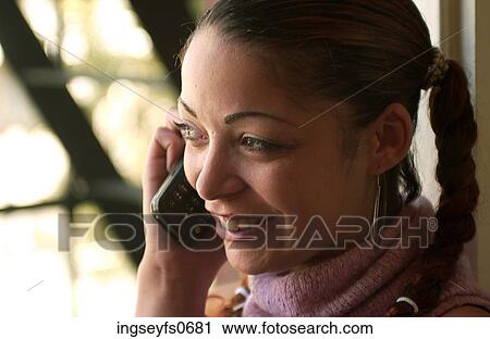 Young Woman on Phone in Sunlight View Large Photo Image Stock Image - Young Woman on Phone in Sunlight. Fotosearch