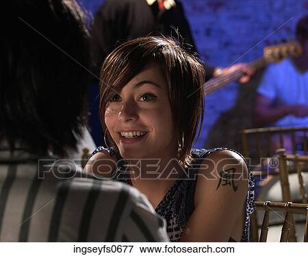 Young Woman with Tattoo View Large Photo Image Stock Photo - Young Woman with Tattoo. Fotosearch