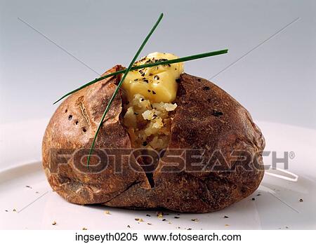 baked potato, baked potatoe, melted butter, chive View Large Photo Image Stock Photography - baked potato, baked potatoe, melted butter, chive. Fotosearch