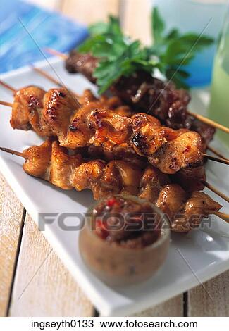 Stock Image - bbq, skewer, kebab, chicken, chicken pieces, dip, food. Fotosearch