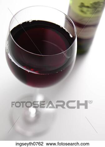 Bottle and a glass of red wine View Large Photo Image Stock Image - Bottle and a glass of red wine. Fotosearch