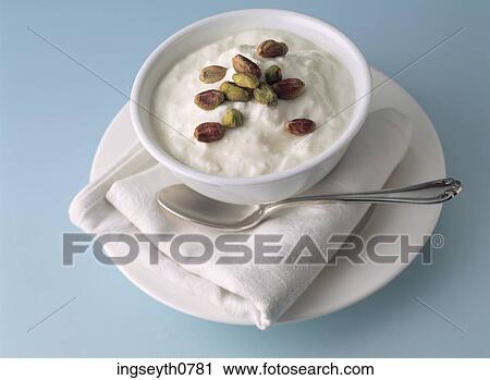 Stock Image - Bottle and a glass of red wine. Fotosearch