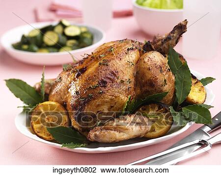 Stock Image - Bottle and a glass of red wine. Fotosearch