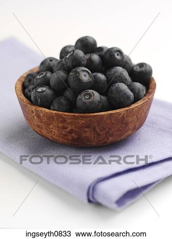 Stock Image - Bottle and a glass of red wine. Fotosearch