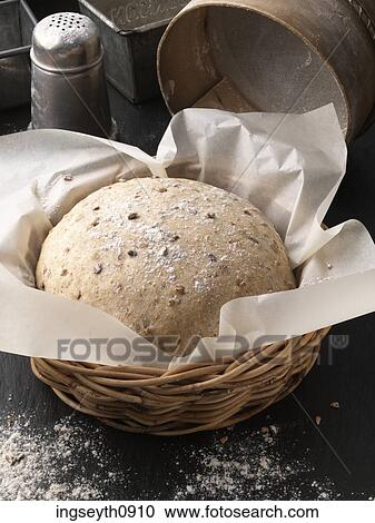 Stock Image - Bottle and a glass of red wine. Fotosearch