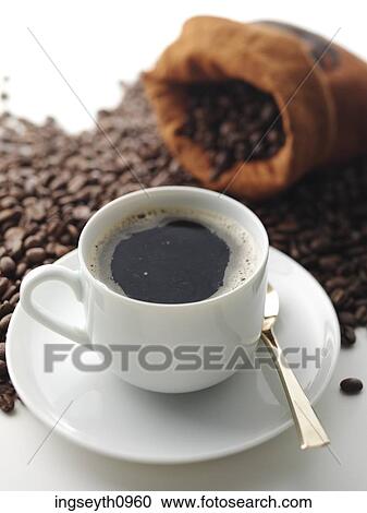 Stock Image - Bottle and a glass of red wine. Fotosearch
