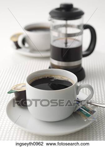 Stock Image - Bottle and a glass of red wine. Fotosearch