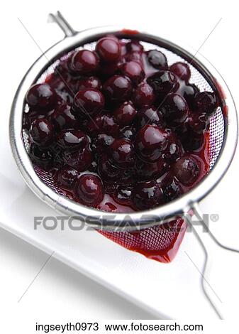 Stock Image - Bottle and a glass of red wine. Fotosearch