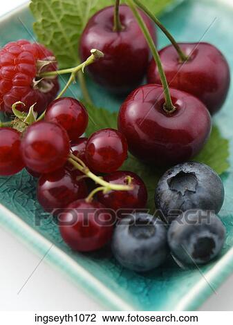 Stock Image - Bottle and a glass of red wine. Fotosearch