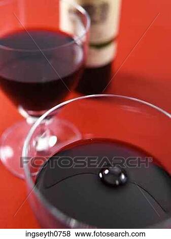 Bottle and a glass of red wine View Large Photo Image Stock Photo - Bottle and a glass of red wine. Fotosearch