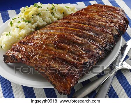 Stock Photo - Bottle and a glass of red wine. Fotosearch