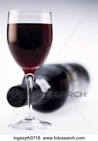 Bottle and a glass of red wine View Large Photo Image Stock Photograph - Bottle and a glass of red wine. Fotosearch