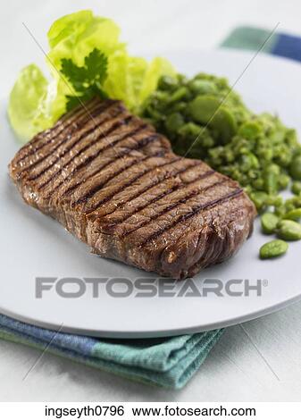 Stock Photograph - Bottle and a glass of red wine. Fotosearch