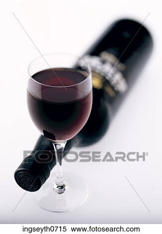 Stock Photography - Bottle and a glass of red wine. Fotosearch
