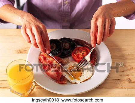Stock Photo - breakfast, fry up, egg, bacon, mushroom, tomato, english breakfast. Fotosearch