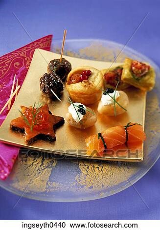 Stock Image - Canapes, star, stars, finger food, savoury Canapes, buffet, food. Fotosearch