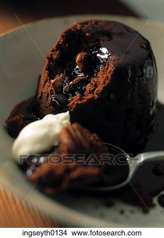 Picture - chocolat pudding, chocolat sponge, chocolat sauce, cream, pudding, dessert, sweet. Fotosearch
