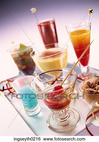 cocktails, deserts, tall glasses, straws, cocktail stick, curacao, tequila sunrise View Large Photo Image Stock Photograph - cocktails, deserts, tall glasses, straws, cocktail stick, curacao, tequila sunrise. Fotosearch