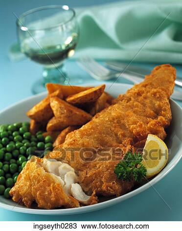 Stock Image - fish and chips, peas, chips, fried fish, white wine, main course, napkin. Fotosearch