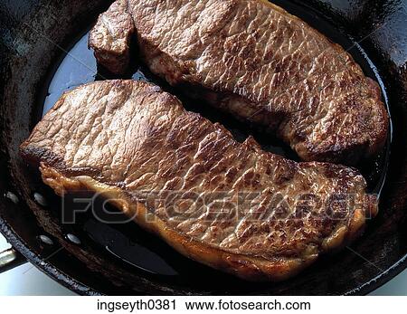 Stock Image - meat, steak, sirloin, grilled, cooked, pan, main course. Fotosearch